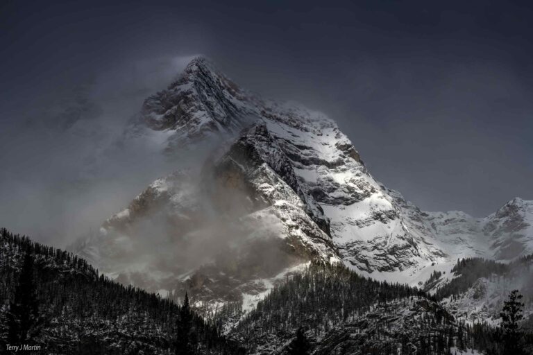 The Snowy peak of one of the mountains in the Canadian Rockies