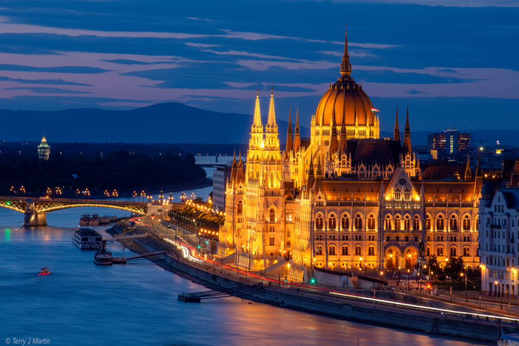The Hungarian Parliament Building in Budapest lit up at twilight