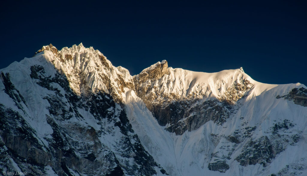 The dawn sunlight hitting the Himalayan Peaks