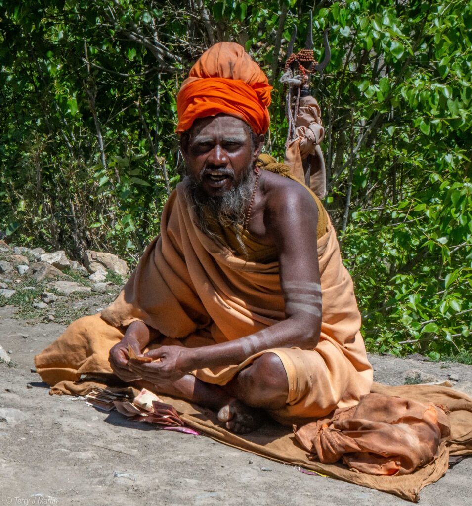 A Nepalese holy man sitting criss-cross