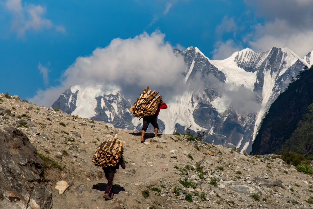 Nepalese porters walking through Langtang Valley