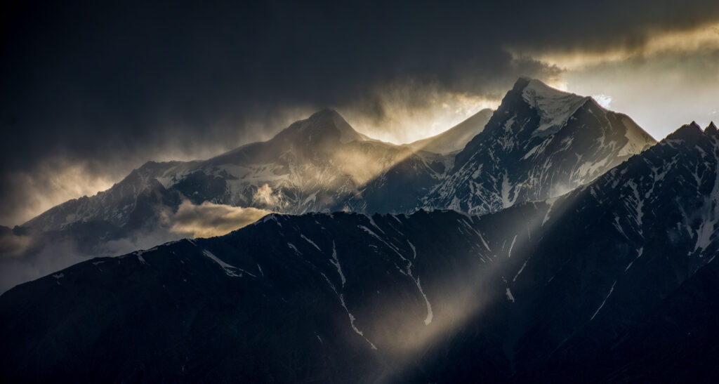 Sunlight streaming from the clouds near Muktinath, Annapurna Circuit