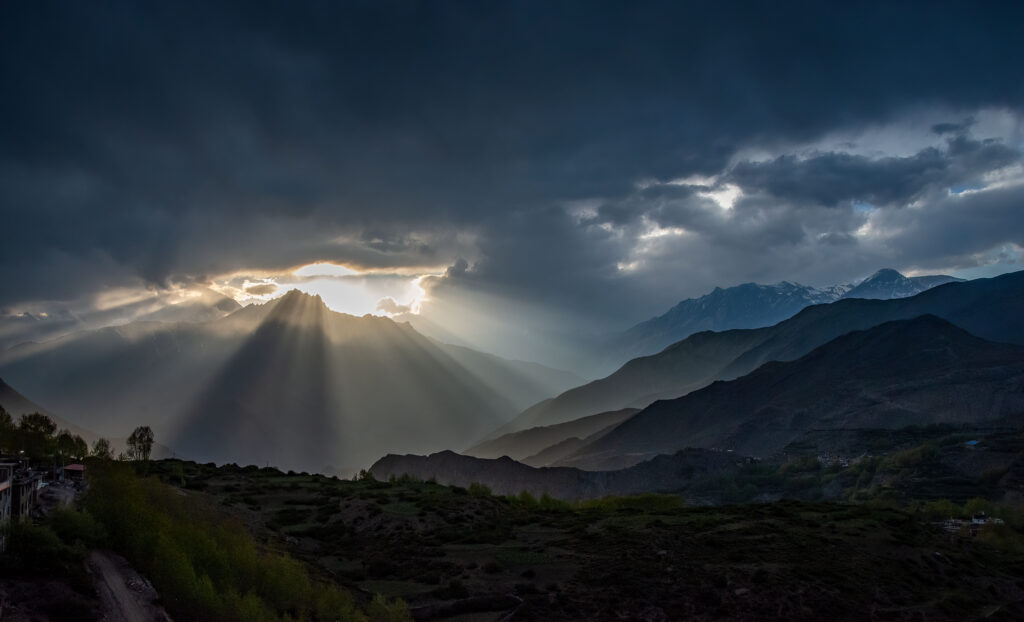 Sunlight streaming from the clouds near Muktinath, Annapurna Circuit