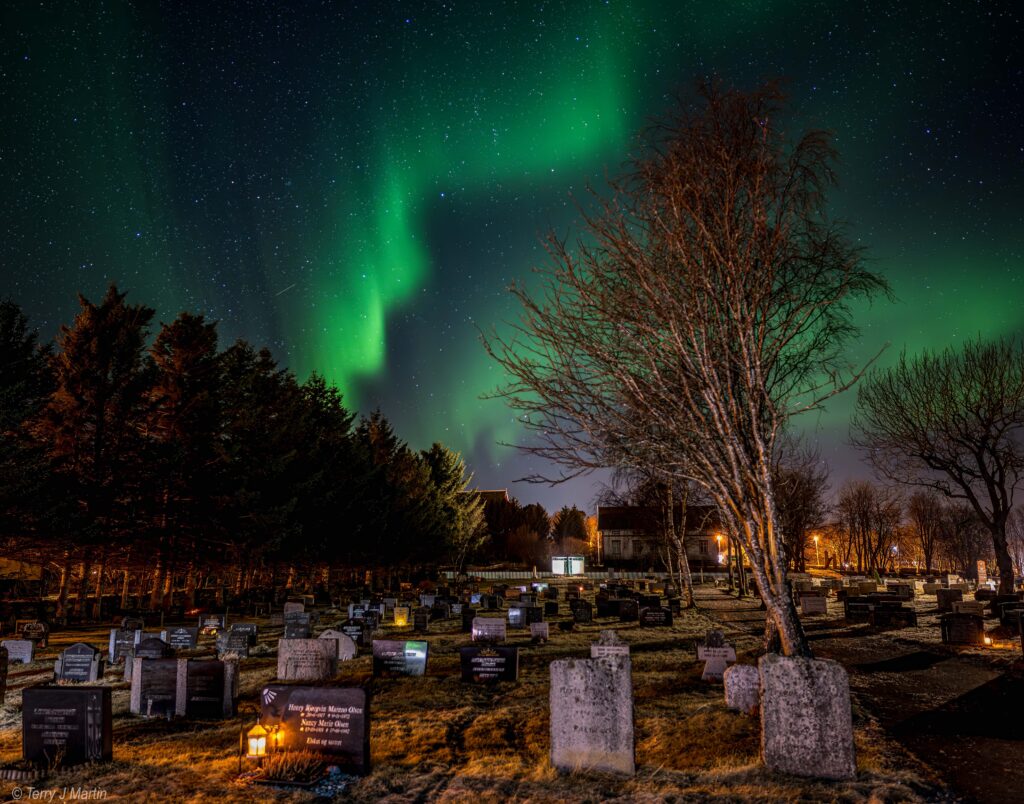 Northern Lights above a cemetery in the Lofoten Islands in Norway